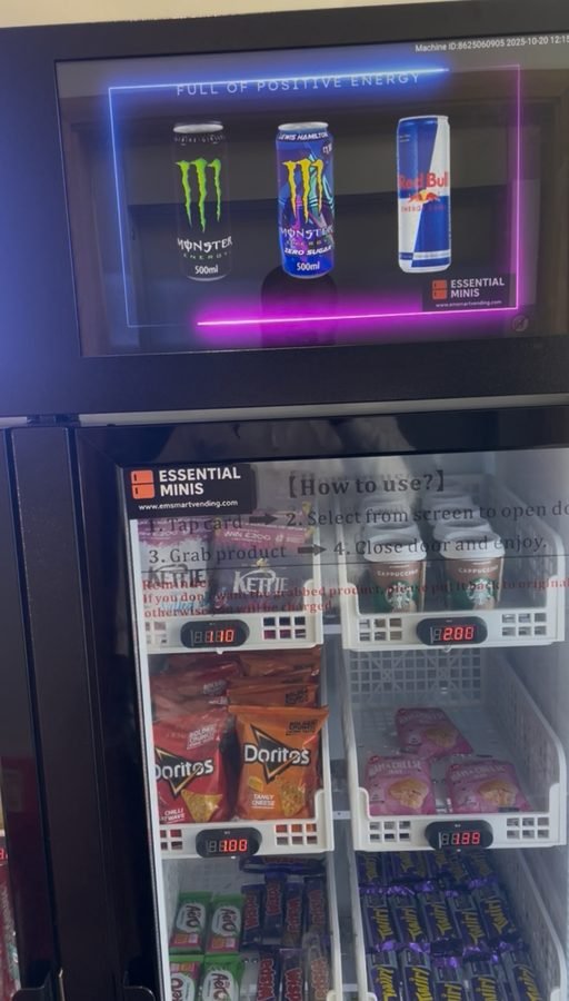 Essential Minis smart vending machine digital screen displaying energy drinks
