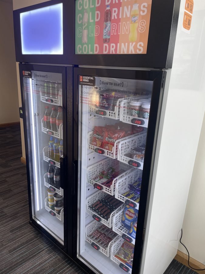 Smart fridge vending machine stocked with cold drinks and snacks in Flitwick