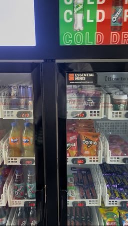 Essential Minis smart vending machine cold drinks section with branded digital display