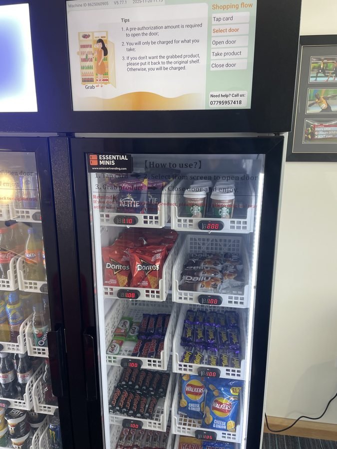 Smart vending machine snack cabinet close up showing Kettle Chips Doritos Starbucks